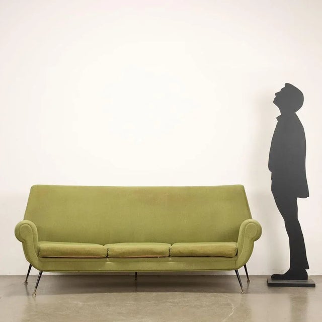 3-seater sofa, foam padding and fabric covering, enamelled metal legs with brass tips. This piece is attributed to the...