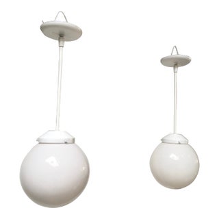 Pair of Mid-Century Modern Feldman Globe Pendant Lights, Los Angeles, Refinished White & Milk Glass For Sale