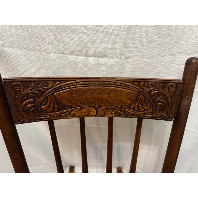 * A stunning, authentic example of 19th-century American folk craftsmanship. This primitive armless sewing rocker (or...