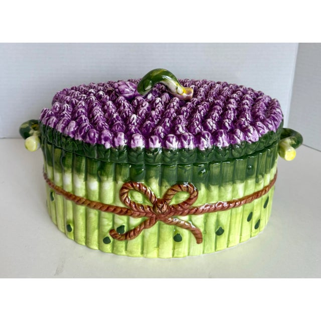 Here is a beautiful ceramic, majolica-style lidded tureen in the figure of a bundle of tied asparagus spears! The piece is...