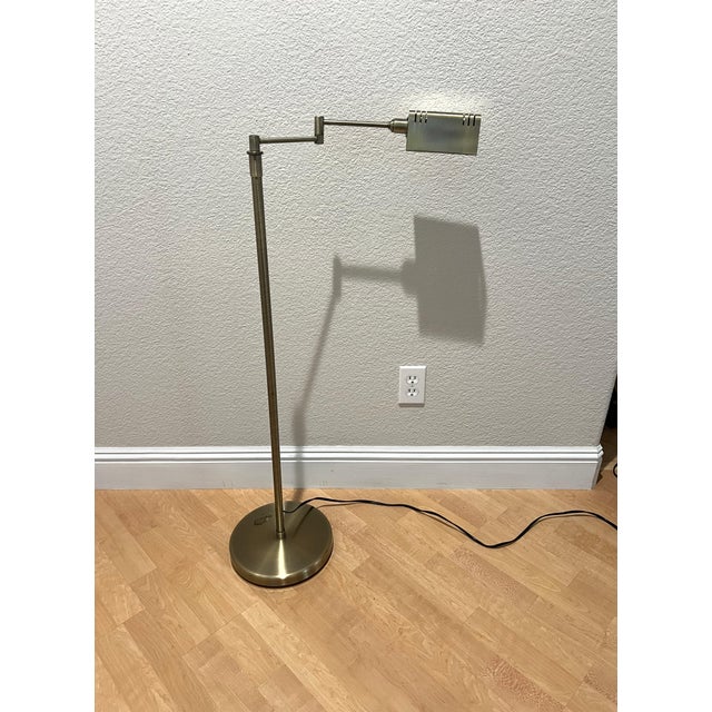 Mid Century Modern Adjustable Brass floor lamp styled after Koch and Lowy. A perfect addition to your library or beside a...