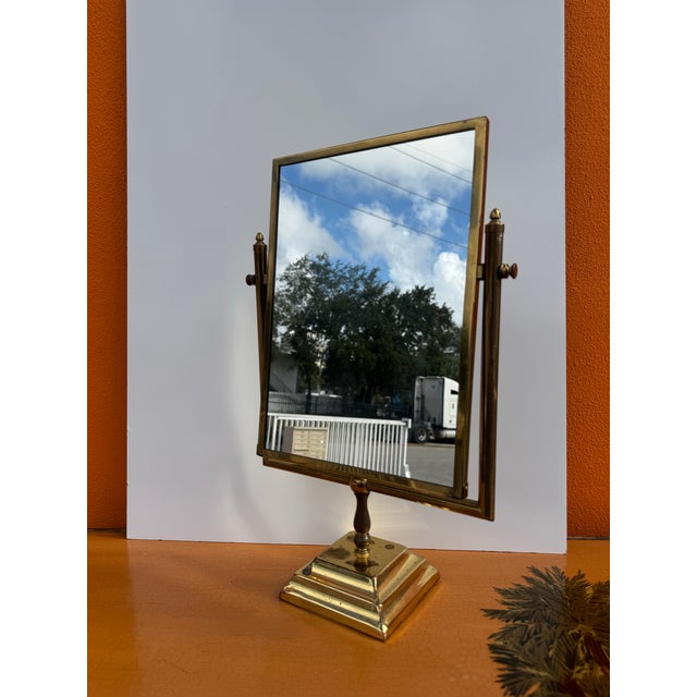 A beautiful 1960’s vintage brass swing vanity mirror, crafted with classic mid-century charm. This elegant piece features...