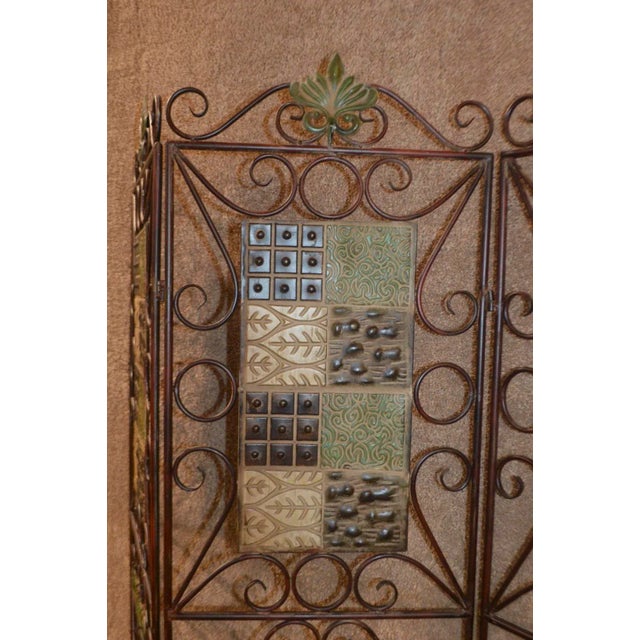 This is a vintage 3-panel folding metal screen/room divider. The piece is from the 1980s.