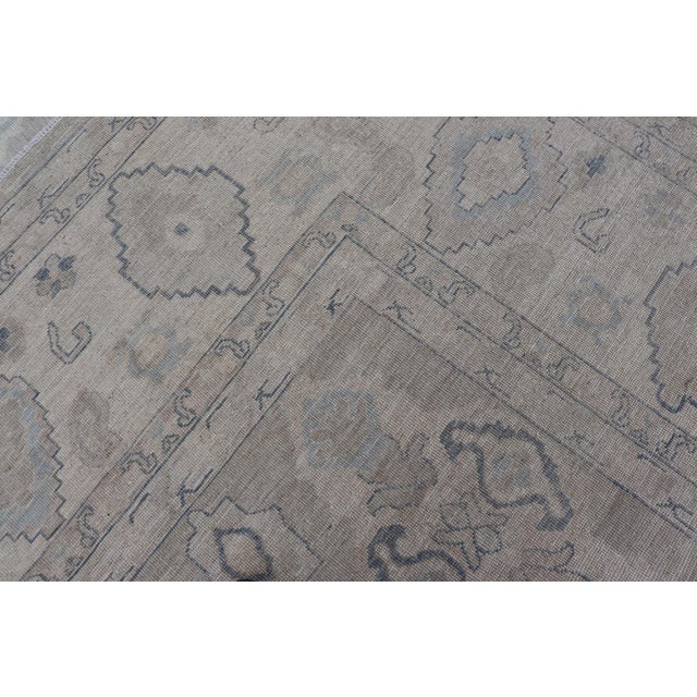 Turkish Oushak Rug With Soft Gray Field and Pale Blue Geometric Motifs For Sale - Image 16 of 16