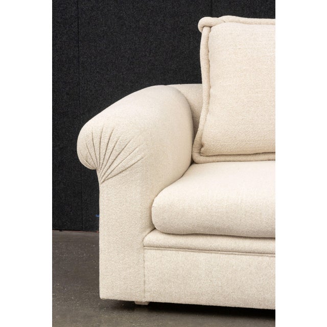 Modern Beige Fabric Upholstered Three-Seat Sofa, with three throw pillows. 28" H x 93" W x 46" D; seat: 20" H. Provenance:...