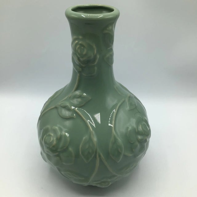 Very nice high raised relief rose pattern on this Chinese export porcelain vase. The green Celadon glaze color and...