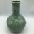 Very nice high raised relief rose pattern on this Chinese export porcelain vase. The green Celadon glaze color and...