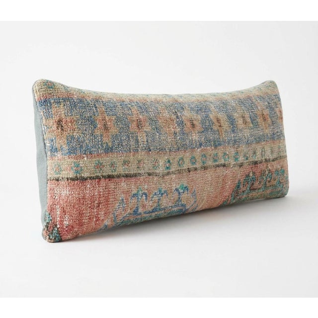 This beautiful 16'' x 48'' pillow cover was made from an authentic Turkish rug. Bright colors of wool adorn the front of...