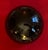 Antique 19th century American blown glass amber witch's ball. Finished with a polished pontil. Measures 6" diameter. Good...
