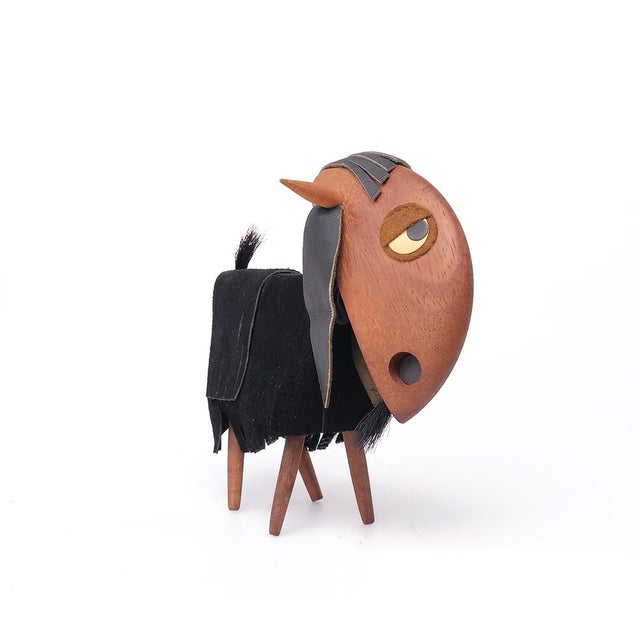 Handmade teak wood figurine of a goat. made by israeli artist frank meisler in the 1960s. the goat has leather ears and...