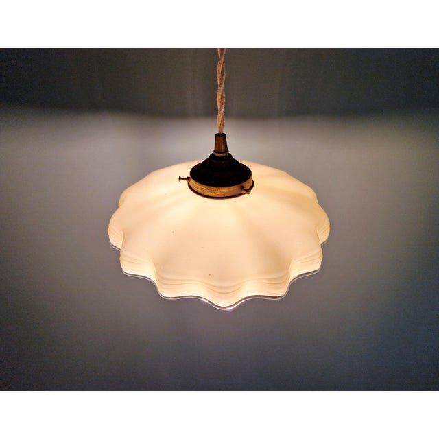 Art Deco pendant light in scalloped yellow opaline glass with uranium glass, 1920s-30s. The pendant has been rewired and...
