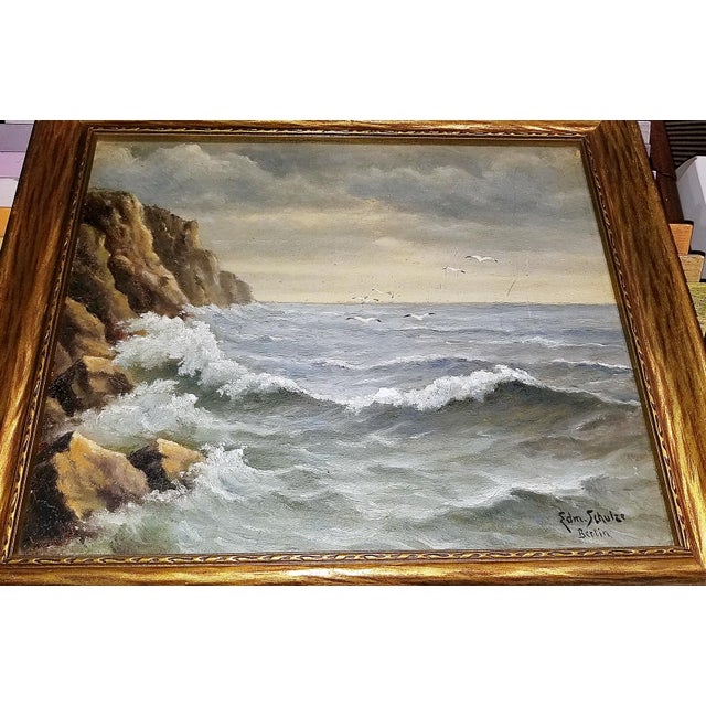 Midcentury 1950s rendition of breaking surf by Berlin artist, Edmund Schultz oil on canvas in a dark bronze wood frame, a...