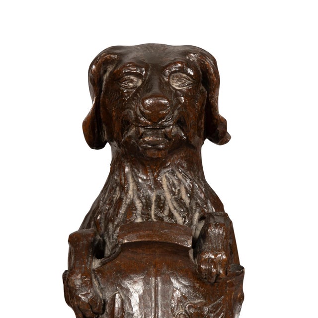 Carved Oak Figures Of Seated Dogs With Shields - a Pair | Chairish