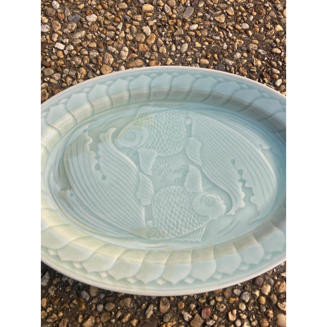 Lovely celadon oval platter with raise koi fish decoration. 14.25” by 9.75”
