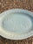 Lovely celadon oval platter with raise koi fish decoration. 14.25” by 9.75”