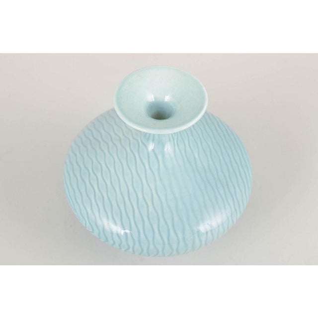 Gunnar Nylund for Rörstrand Vase, mid-20th century. Elegant and organically shaped stoneware vase with a wavy pattern...