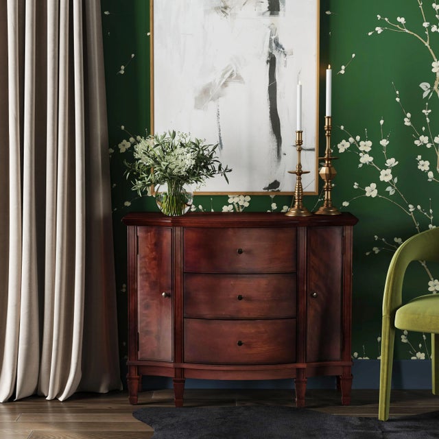 Offering abundant storage behind two doors and inside three dovetailed drawers, this spacious console cabinet is crafted...