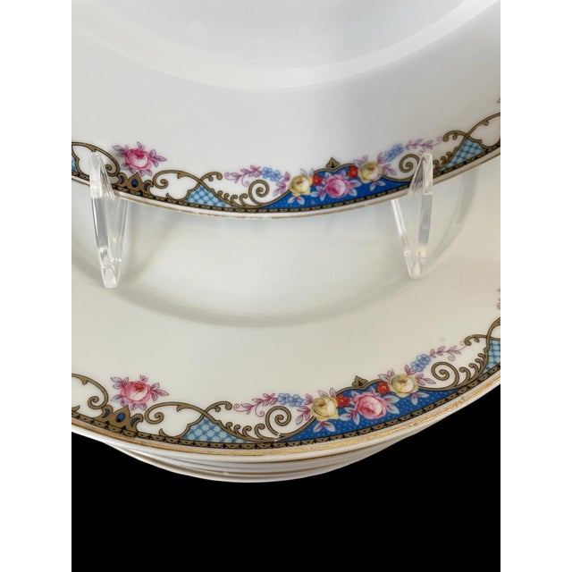 The SET of 10 EPAIG Dinner Plates from Czechoslovakia features a beautiful floral pattern with a gold band, blue garland,...