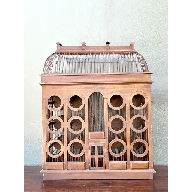 This striking vintage wine rack is a masterclass in architectural whimsy, designed to resemble a monumental Gothic...