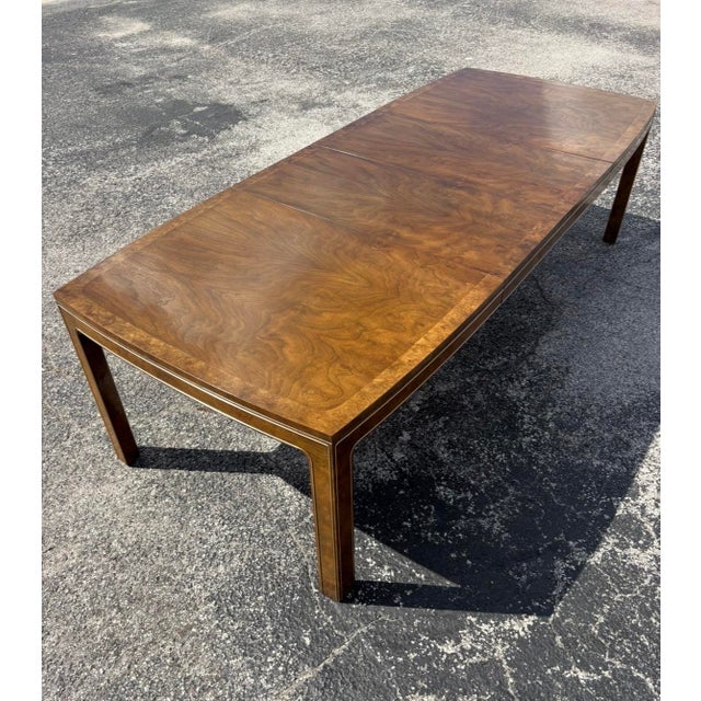 An exquisite Mastercraft dining set with striking burl accented throughout the table and in the chair frames. Table has...