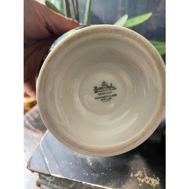 Stunning porcelain piece by Rosenthal presented in a deep black matte finish with Handpainted pink rose spray across front...