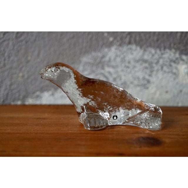 This glass seal is a production by Uno Westerberg for the Swedish Pukeberg glassworks. The work is fine and delicate, full...