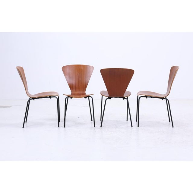 Set of 4 Teak Chairs in Danish Design Set FEATURES * High-quality workmanship * Material: Teak & steel tubing * Timeless...