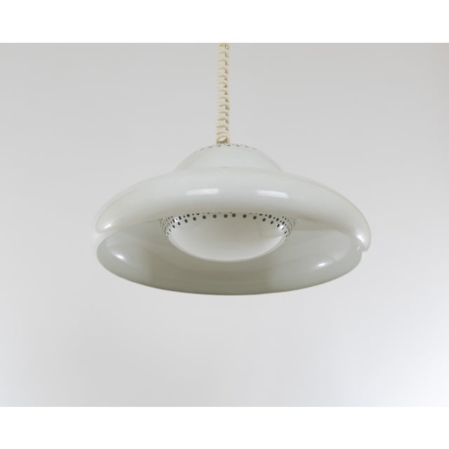White Fior di Loto pendant designed by Tobia and Afra Scarpa for Italian Lighting manufacturer Flos in 1963. In a Flos...
