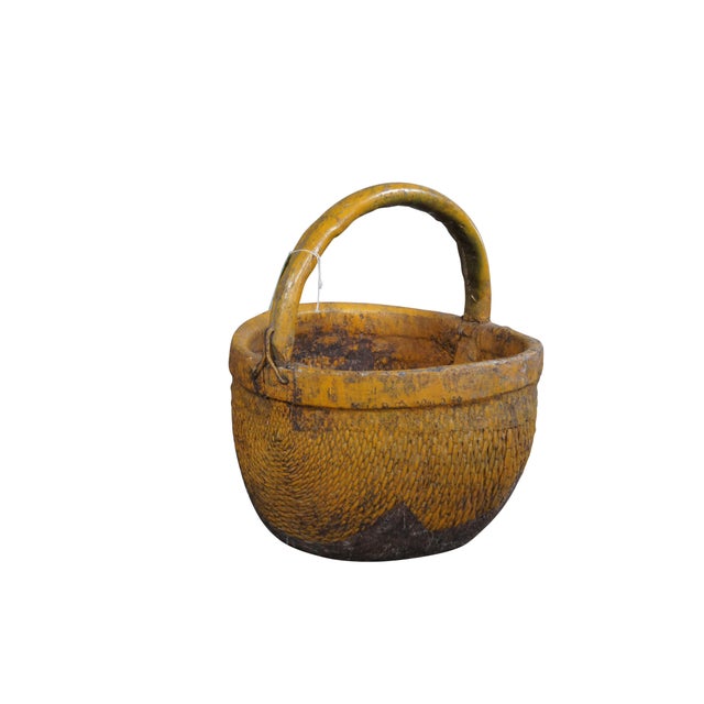 Antique Chinese rice basket featuring woven reed and willow with bentwood handle. Finished with a yellow boho paint....