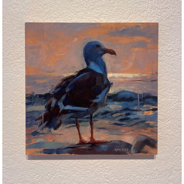 This oil painting depicts a solitary sea gull standing against a soft, atmospheric backdrop of a sunset. The artist...