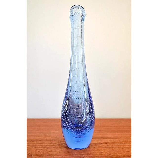 Danish glass vase "Duckling" from by lüken for the glass manufactory Holmegaard from the 1950s. The vase is made of a blue...