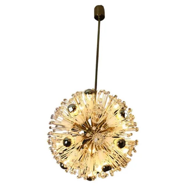This spectacular sputnik chandelier looks like a flowers explosion.it features a multitude of brass rods ending with bulbs...