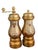 An exceptionally decorative vintage Italian salt shaker and hand-cranked pepper mill featuring elaborate Baroque Revival...