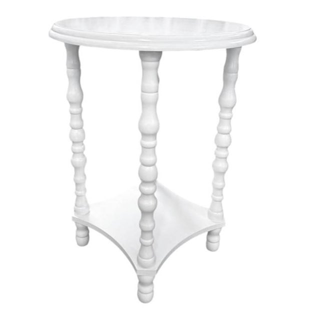 Elegant vintage side table featuring turned spindle legs and a graceful round top. The four intricately turned legs are...
