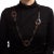 Pre-owned Hermes Attelage horn necklace with larger peach lacquered links. The necklace features polished horn links in a...