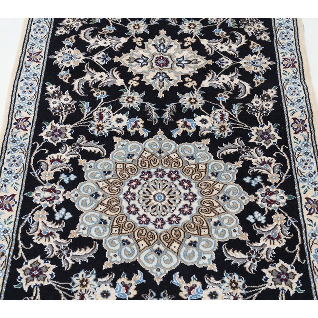 Nain rugs are renowned for their detail and fine use of outlining along the central motifs. Breaking from the classical...