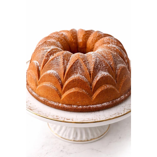 Mid 20th century German copper cake and jelly mold with a dramatic geometric fluted design and richly aged copper surface....