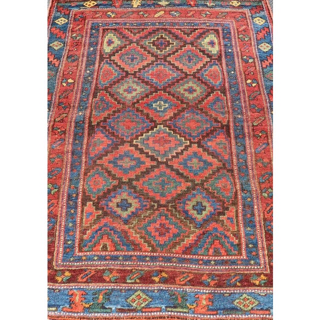 Antique Tribal Kurdish Rug With All-Over Tribal Motifs in Bright Colors. Keivan Woven Arts / rug W22-1004, country of...