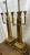 Pair of brass cathedral – style lamps with four candlestick holders each