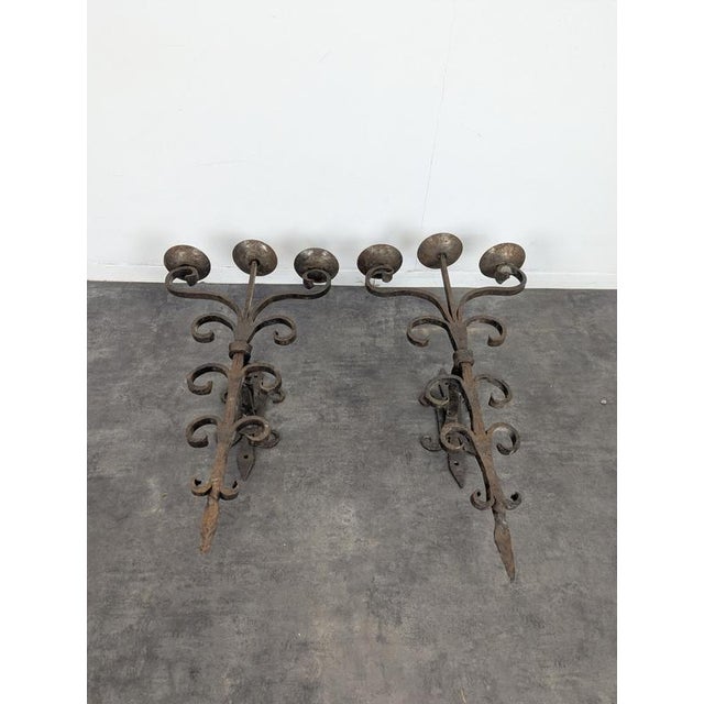 Three-Light Wrought Iron Wall Sconces, Set of 2, in Very Good conditions. Up to 250V (Europe/UK Standard).The wiring of...