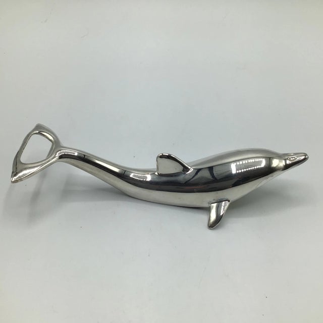 Silver plated dolphin bottle opener has a pop top opener on the tail with screw top opener on the underside. Also included...