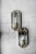 This set of two geometric wall lamps was manufactured in Italy during the 1970s. It has a three-dimensional form. The...