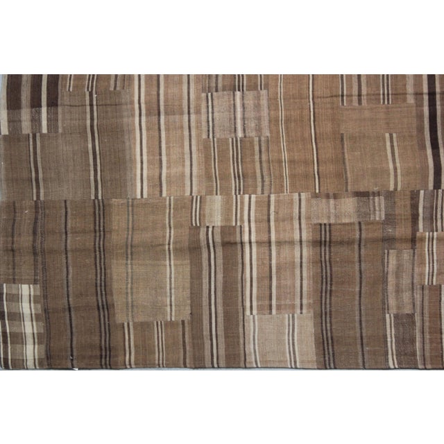 A beautiful Vintage Patchwork Kilim . It's in very good condition, practically new. This Patchworks kilim is produced of...