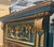 This is a monumental Italian neoclassical trumeau mirror with Louis XVI styling. It has beautiful carved applied giltwood...