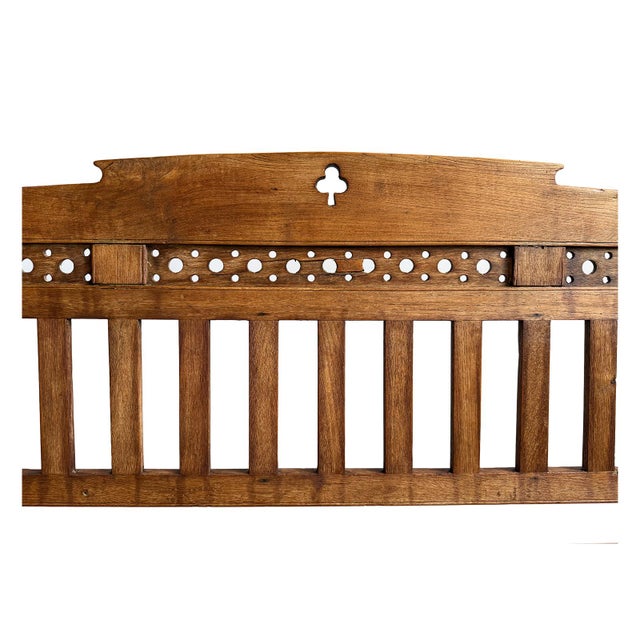 Vintage Colonial solid teak wood slat bench. Warm medium brown finish. Dotted cut out detail on back adds charm and...