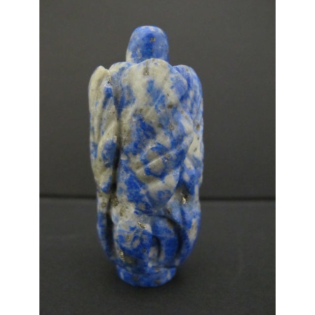 Hand carved Chinese snuff bottle made from natural Lapis Lazuli stone. Showing relief carved organic or vegetative leaf...