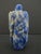 Hand carved Chinese snuff bottle made from natural Lapis Lazuli stone. Showing relief carved organic or vegetative leaf...