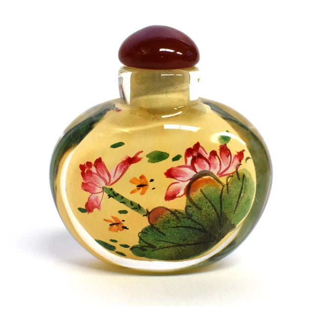 Our snuff bottles are topped with gemstone grade agate lids and 100% hand painted from within. The Chinese art of eglomise...