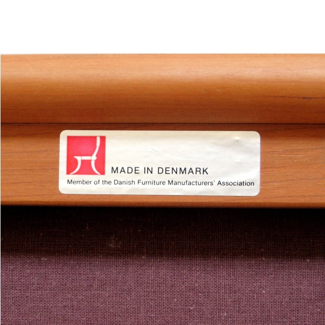 Danish design vintage three seater sofa, made in the 1960s. The frame is made of cherry wood. The seat cushions can be...