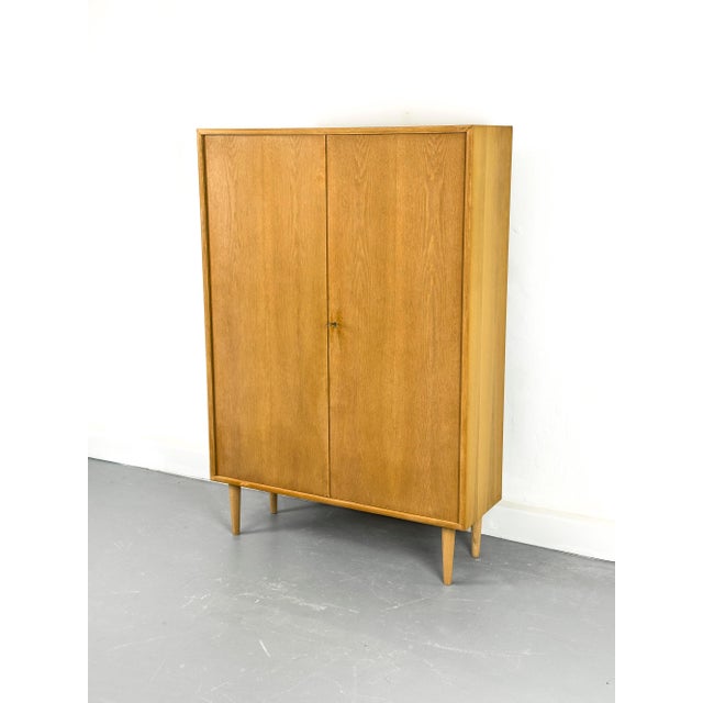 High-quality, two-door cabinet in a minimalist Scandinavian design with four adjustable shelves. Product information: •...